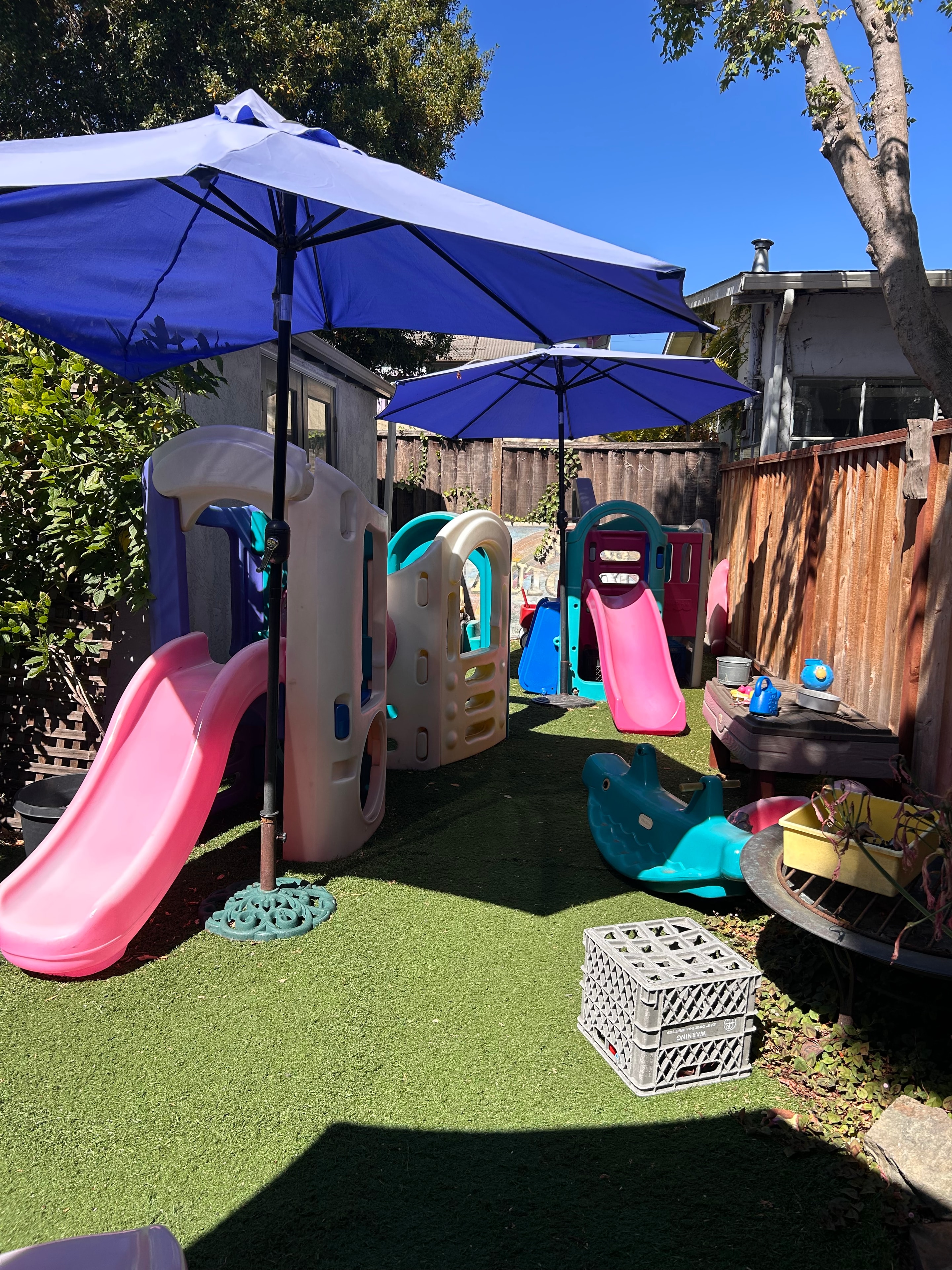 Children playing cornhole game outdoors