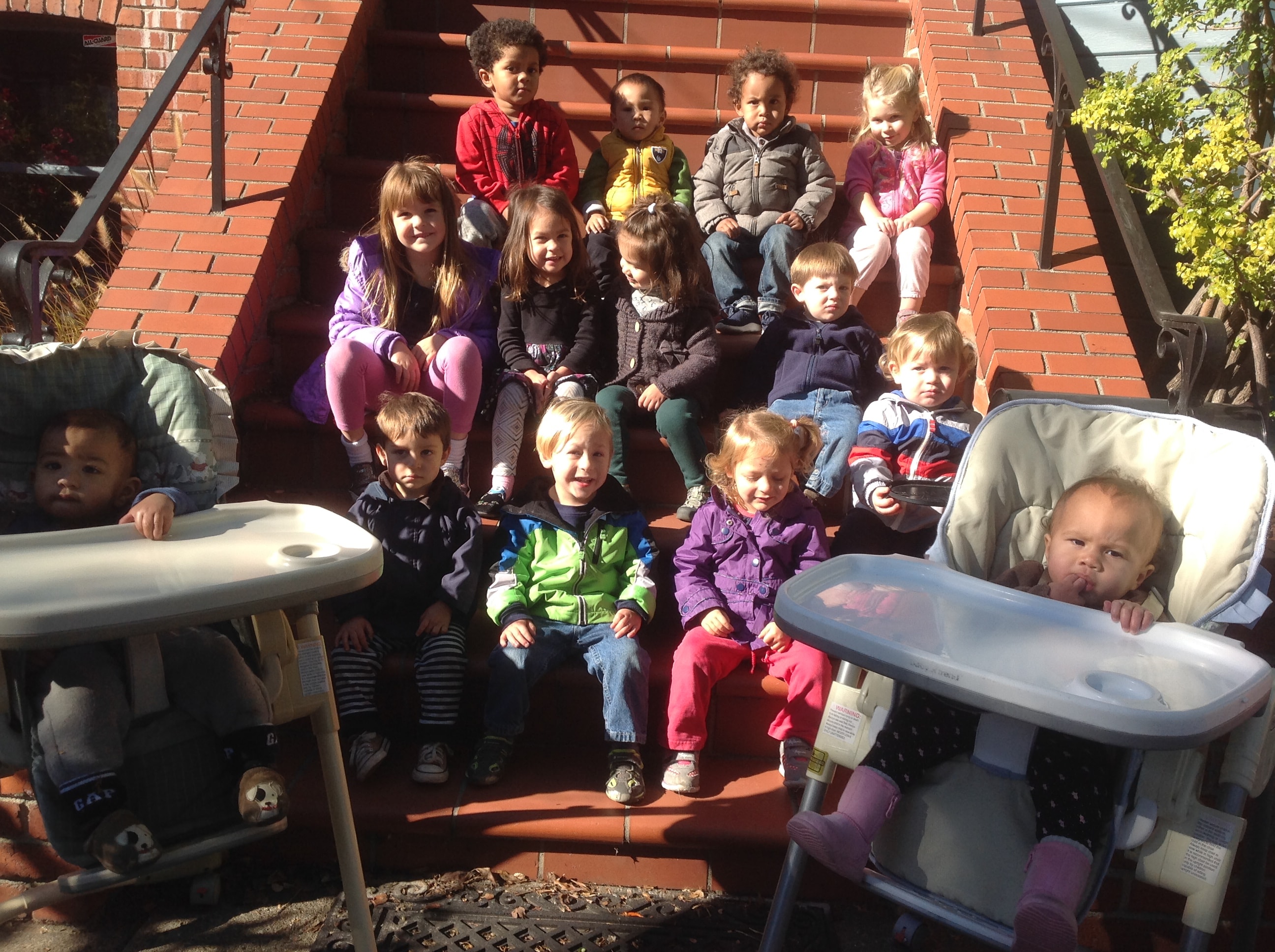 Caregiver playing with toddlers at Little Crumbles
