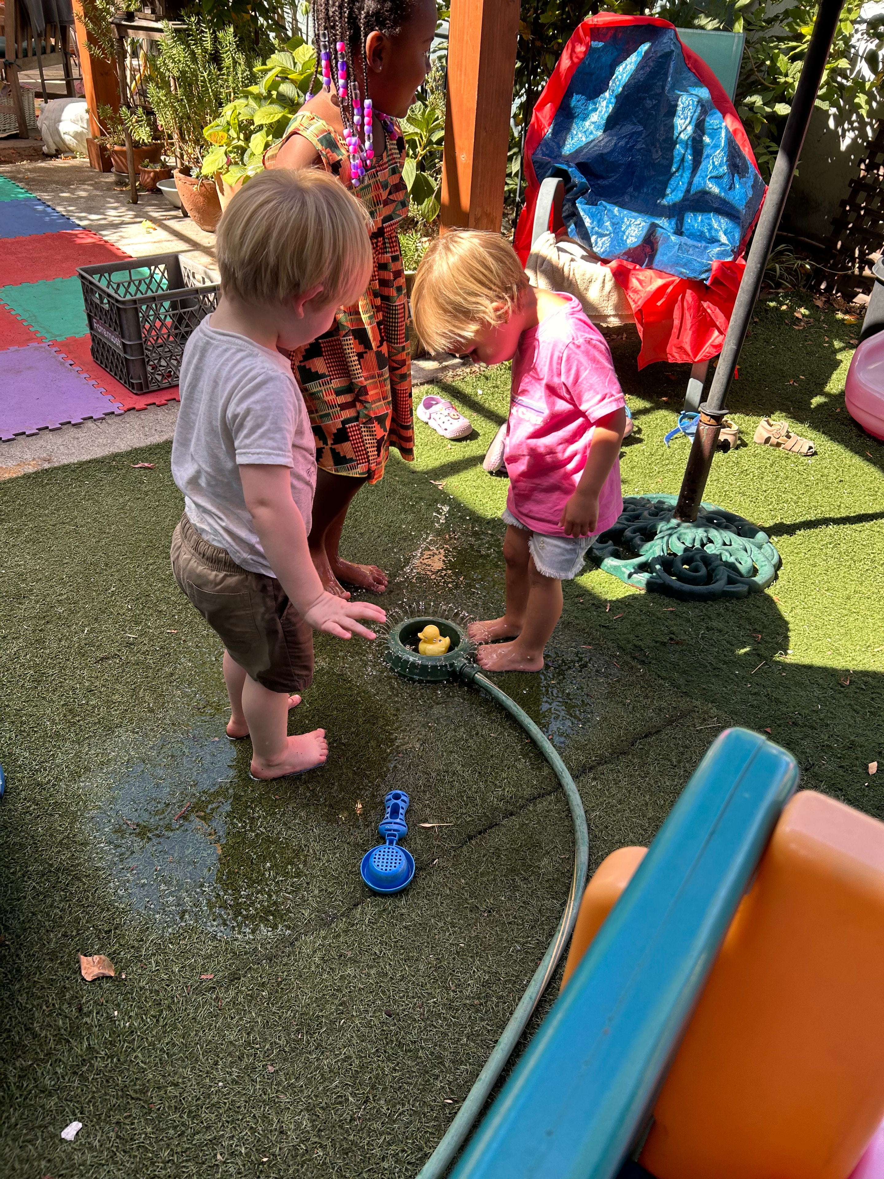 Children playing in water at Little Crumbles